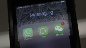 File photo illustration shows icons messaging WhatsApp, Laiwang and WeChat на экране smart phone in Beijing