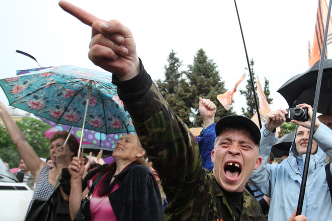 People gather for the announcement of referendum results in Lugansk