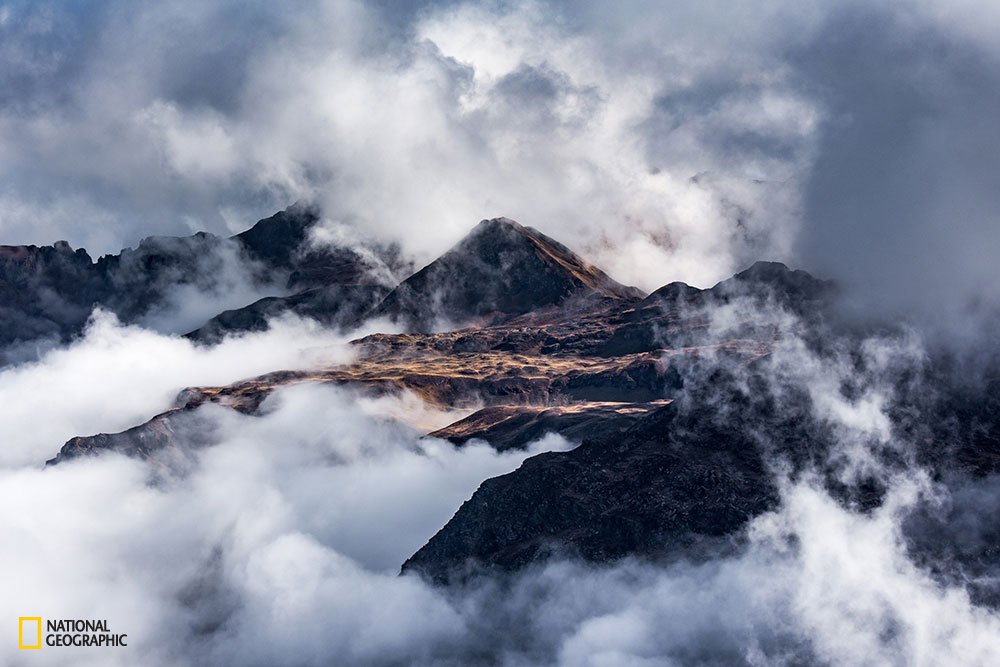 Breathtaking view from Schwarzstockli (2293m) over this spectacular natural border of cantons of Glarus and St. Gallen, Switzerland, as seen on an Autumn weekend trek in early October 2015. All after being chased, caught up and left behind by that glorious mist that hopped from one valley to another, leaving me with this frame to awe at. The gathering of clouds.